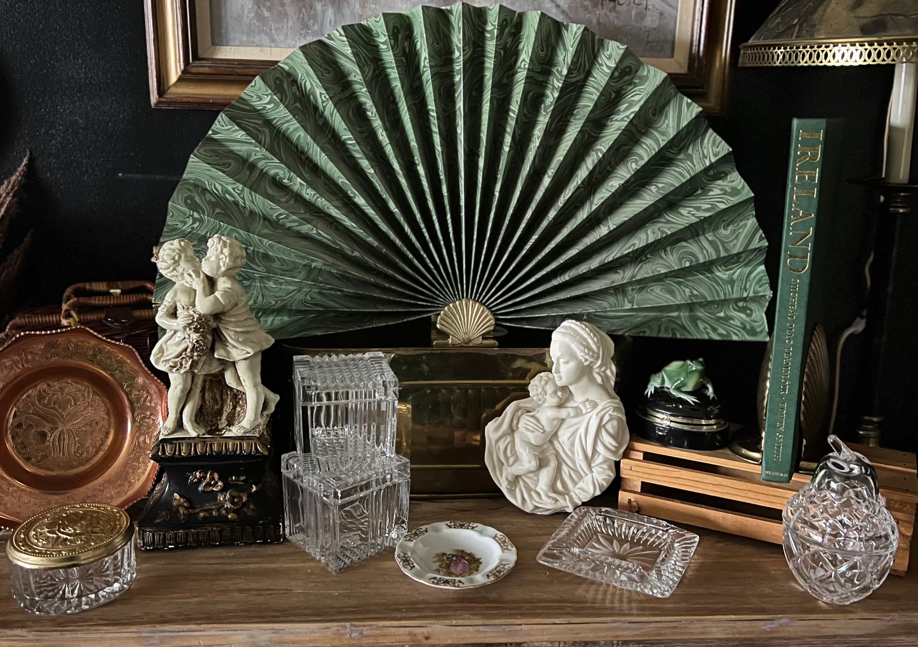 antique collection of glasses and statues